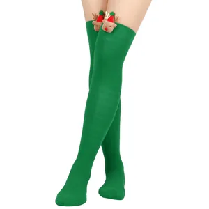 Detail view of green Christmas thigh-high socks with cute 3D plush reindeer ornament.