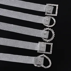 Detail view of various rhinestone belt buckle shapes including heart and square