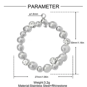 Macro view of stainless steel round pendant with 1.18 inch height and rhinestone detail
