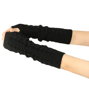 Detailed macro view of black cable knit long fingerless arm warmers for winter warmth