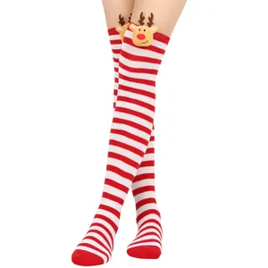 Festive red and white striped over-the-knee Christmas socks with cute reindeer plush decoration.