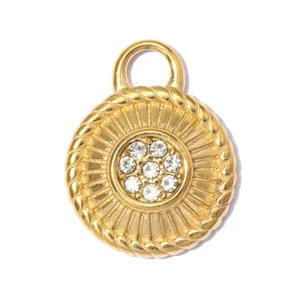 Macro detail of golden stainless steel sun compass pendant with central rhinestone cluster