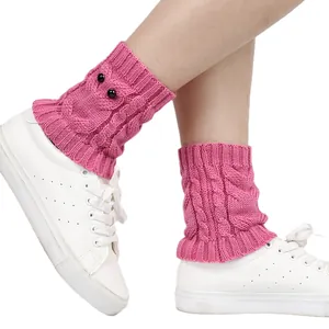 Pink cable knit leg warmers with cute owl eyes design for winter boots and shoes