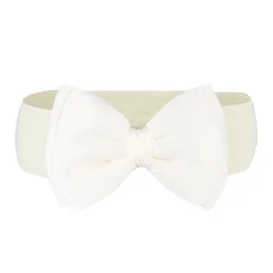 Close-up detail of a cream-colored elastic waist belt with a large decorative chiffon bow.