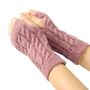 Close-up of pink cable knit fingerless gloves for women, warm winter arm warmers
