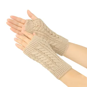 Detailed view of beige cable knit fingerless gloves with elegant hollow patterns