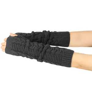 Close-up of black cable-knit long fingerless gloves showing texture and fit