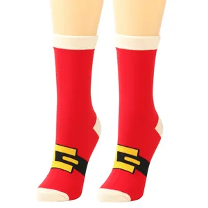 Detailed close-up of festive red Christmas socks with a decorative Santa belt buckle.
