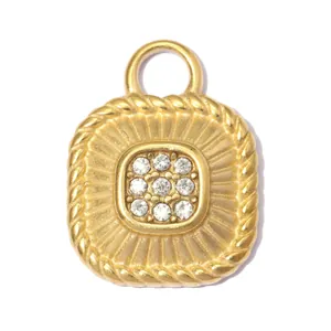 Macro detail of vintage gold sunburst relief pendant with sparkling crystal center cluster