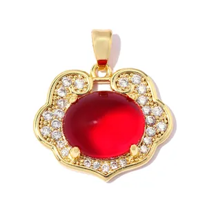 Detailed view of an 18K gold-plated Ruyi lock pendant with red and white zircons.