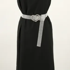 Elegant full rhinestone belt for women featuring a sparkling heart shaped buckle detail.