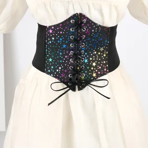 Detail view of wide elastic corset belt with colorful rainbow star print and lace-up front