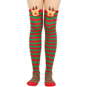 Detail view of Christmas over-the-knee socks with red and green stripes and 3D reindeer heads