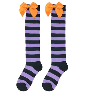 Purple and black striped over-the-knee Halloween socks for girls with orange satin bows.