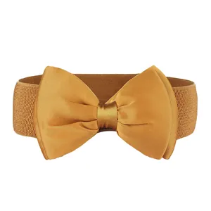 Close-up front view of a decorative mustard yellow elastic bow belt for women and girls