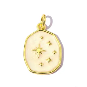 Detailed close-up showing the golden star motifs and pink enamel on a charm pendant
