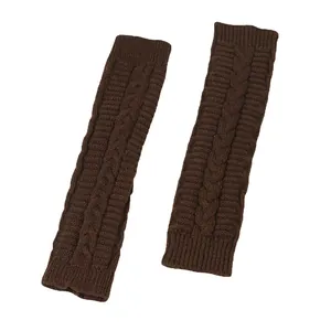 Detailed view of chocolate brown cable-knit long fingerless arm warmers on white background.
