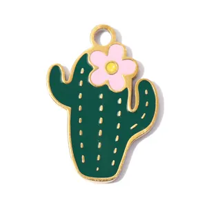 Close-up of a dark green cactus enamel pendant with a small pink flower detail