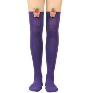 Detail view of purple Christmas over-the-knee socks with plush reindeer decorations