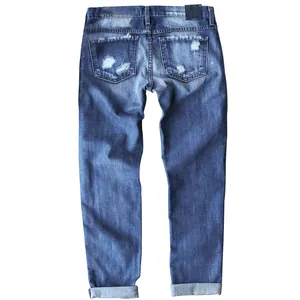 Back view of slim fit distressed blue denim jeans for women with ripped pockets