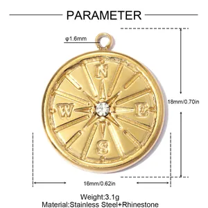 Close-up of gold stainless steel compass pendant with rhinestone and size parameters
