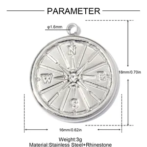 Detail of stainless steel compass pendant with 16mm diameter and central rhinestone