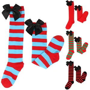 Detail view of children's Halloween thigh-high socks with black satin bows and stripes