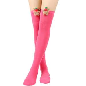 Pink Christmas thigh-high stockings with cute plush reindeer decorations and holiday theme.