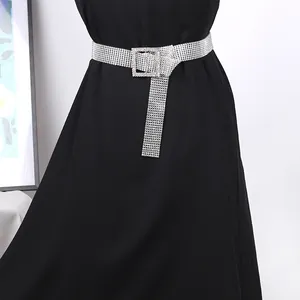 Shining silver rhinestone belt for women with square buckle over black dress