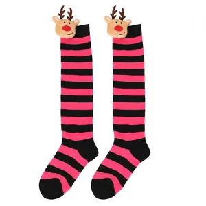 Detailed view of children's festive pink striped Christmas knee-high socks with reindeer dolls