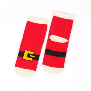Close-up of festive red Christmas socks with Santa belt design and yellow buckle