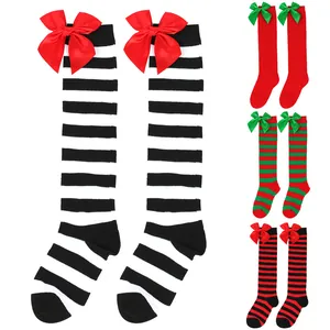 Detail view of festive girls knee-high socks with bows in various striped patterns
