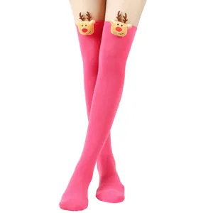 Detailed view of pink thigh-high Christmas socks with plush reindeer embellishments