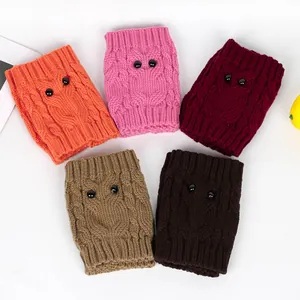 Detailed view of owl knit leg warmers in various colors with button eye accents