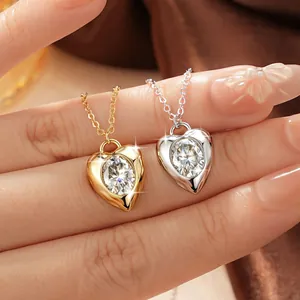 Close-up of French vintage heart necklaces with 2ct oval Moissanite stones