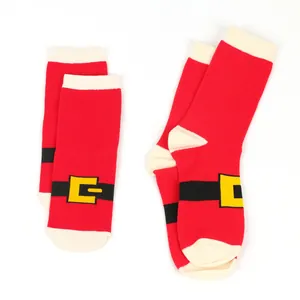 Detailed macro view of festive Santa Claus belt patterned Christmas socks in red.