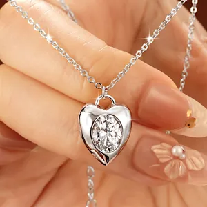 Close-up of a brilliant 2ct moissanite heart pendant necklace in silver finish