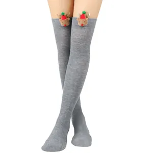 Detailed view of grey over-the-knee Christmas socks with cute 3D reindeer decor.