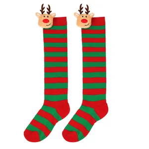 Detailed view of kids Christmas striped knee high socks with 3D plush reindeer dolls