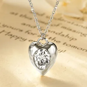 Close-up of vintage heart pendant featuring a 2-carat sparkling moissanite stone
