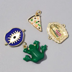 Selection of colorful copper zircon pendants: evil eye, pizza slice, and frog charms.