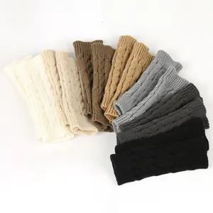 Selection of cable knit fingerless gloves and warm arm sleeves in various neutral colors