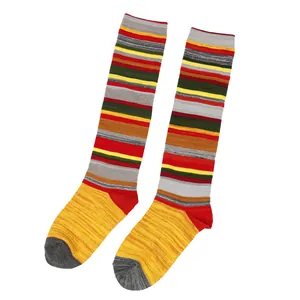 Close-up of vintage Harajuku style colorful striped knee-high cotton socks for women