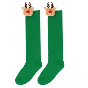 Cute green children's Christmas knee-high socks featuring festive 3D reindeer plush heads.