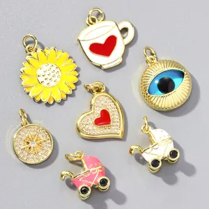 Detail view of colorful enamel and zircon charms featuring evil eye and heart designs.