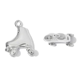 Detailed view of two silver vintage roller skate charms made of high-quality stainless steel