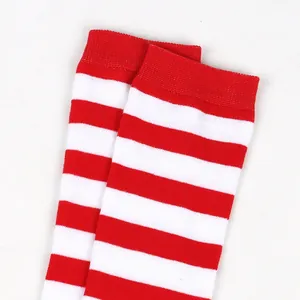 Detail macro view of red and white striped children's knee-high Christmas cotton socks