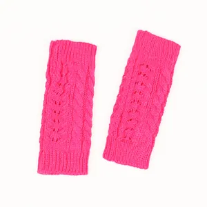 Detailed view of hot pink cable knit fingerless gloves with a stylish hollow-out pattern