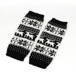 Detailed knit texture of leg warmers with Christmas snowflake and reindeer patterns