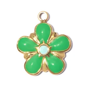 Detail of a green enamel five-petal flower charm with gold-plated stainless steel edges.